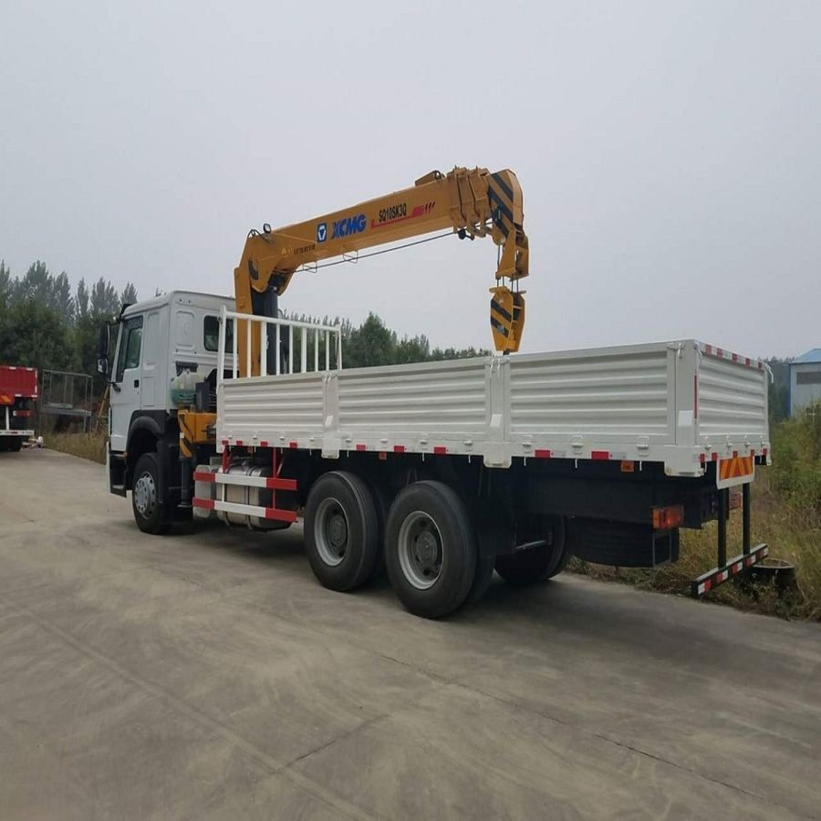 Boom truck crane for hire on job site